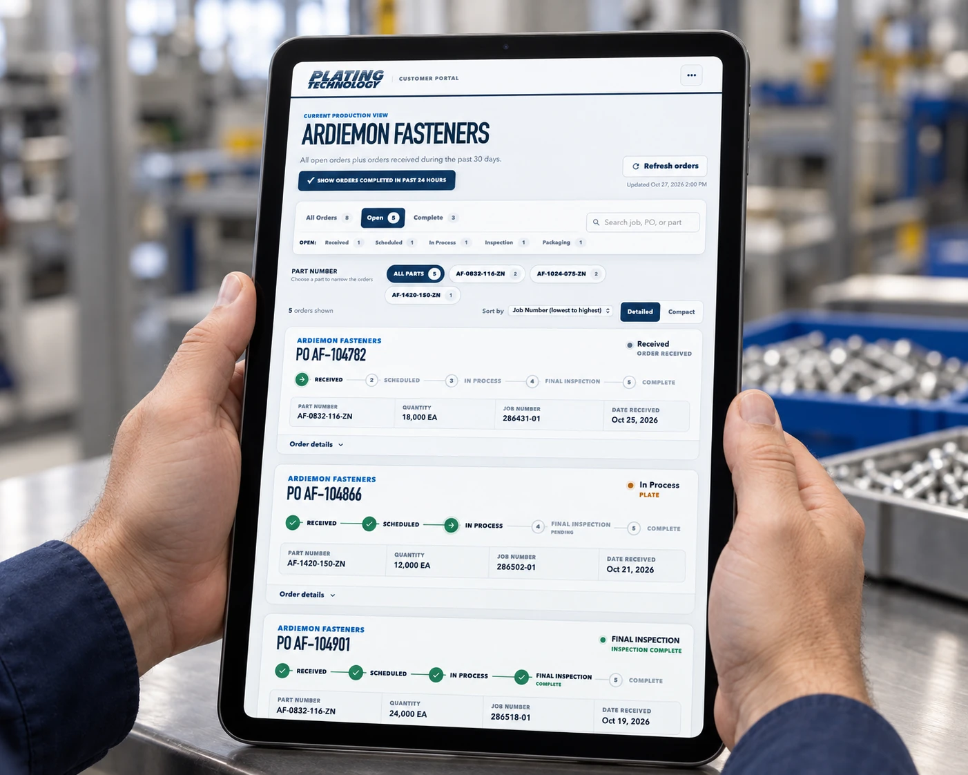 Hands holding an iPad displaying the Plating Technology customer portal
